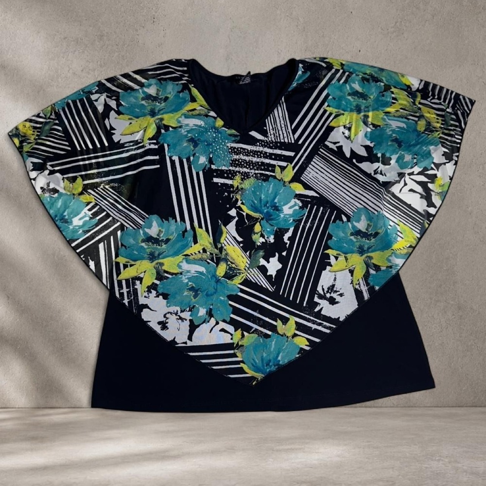 Liz McCoy black floral top with short sleeves and V-neckline.
